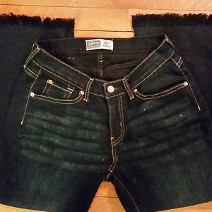 Hand-fringed bootcut crops, dark rinse, mid rise